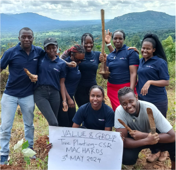 Value 8 Group team enjoying a photo session before  interacting with children at Happy Life Christian School - Children’s Home